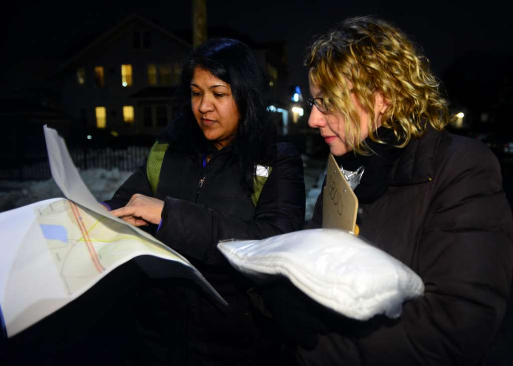 Volunteers Lisa Bahadosingh and Cathy DiTuri, right, stop to check the map as they take part in the annual Point-in-Time count, which is a census of the Connecticut homeless population, on the East End in Bridgeport, Conn. on Tuesday Jan. 26, 2016. Photo: Connecticut Post